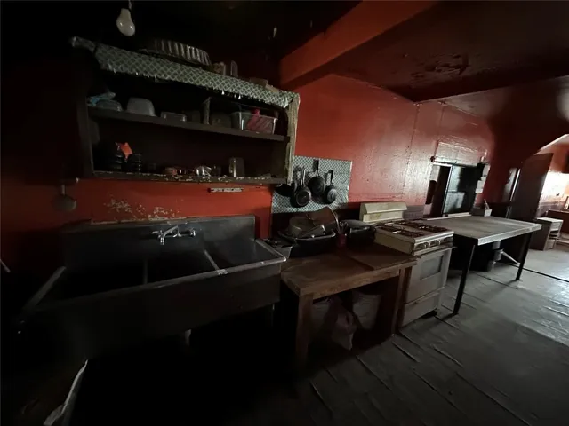 a view of a chairs and table in a patio