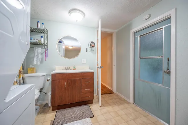 a bathroom with a sink vanity and a mirror