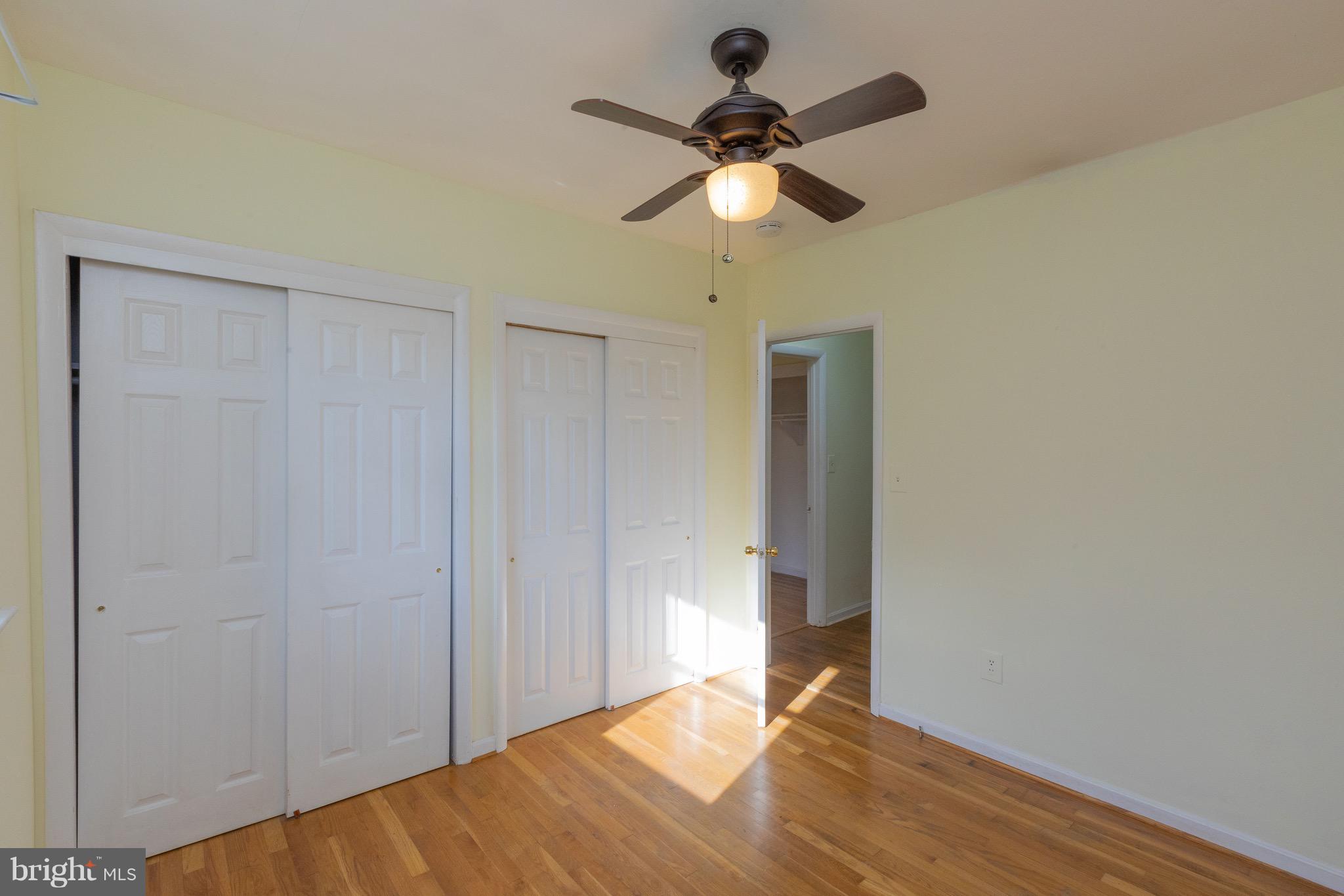 15414 Peach Orchard Road Silver Spring, MD 20905 - Photo 12 of 19 a view of empty room with wooden floor