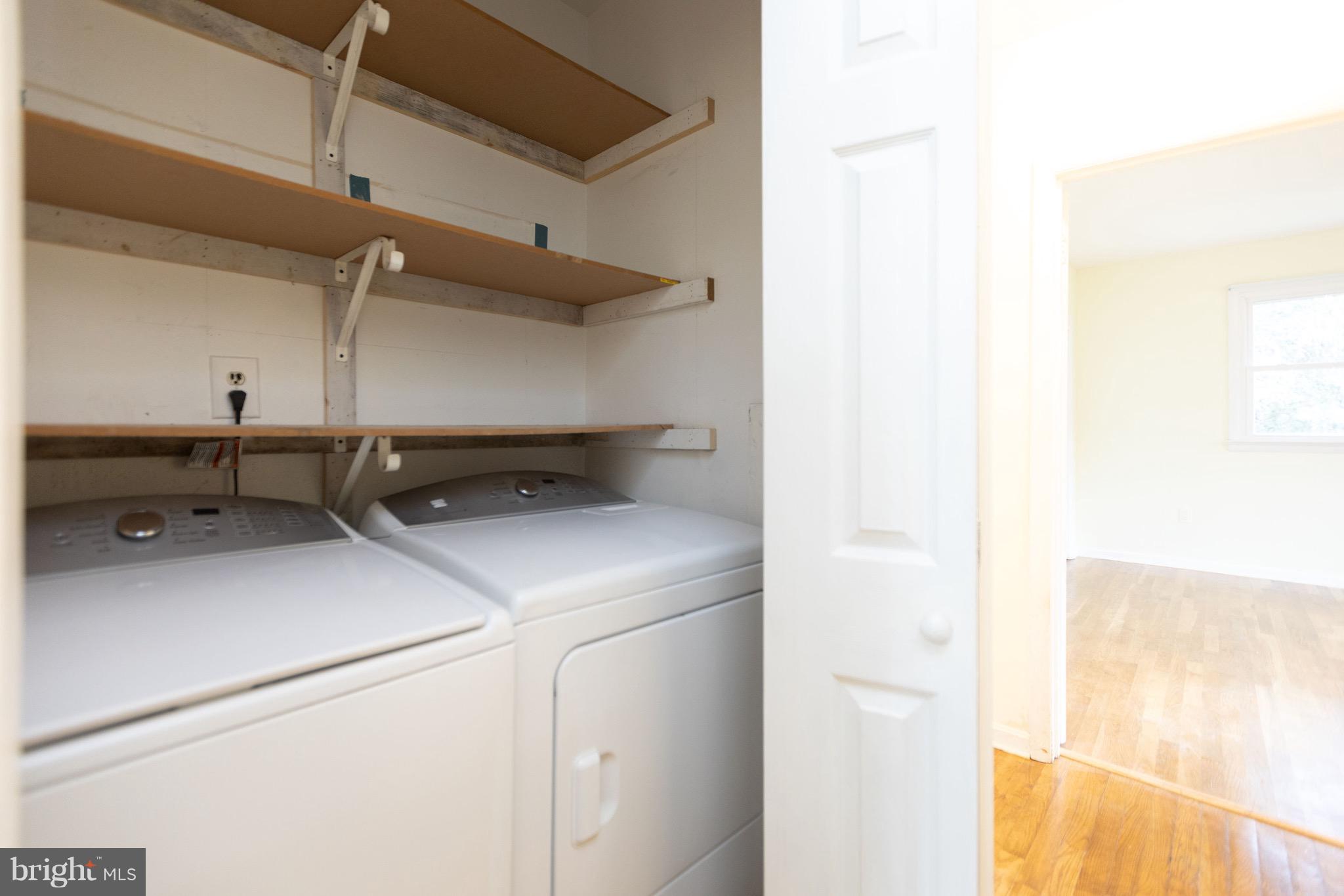 15414 Peach Orchard Road Silver Spring, MD 20905 - Photo 14 of 19 a utility room with dryer and washer