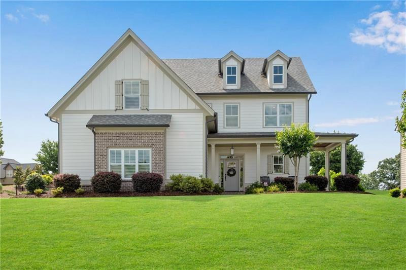 485 Delaperriere Loop Jefferson, GA 30549 - Photo 11 of 71 a front view of a house with a garden
