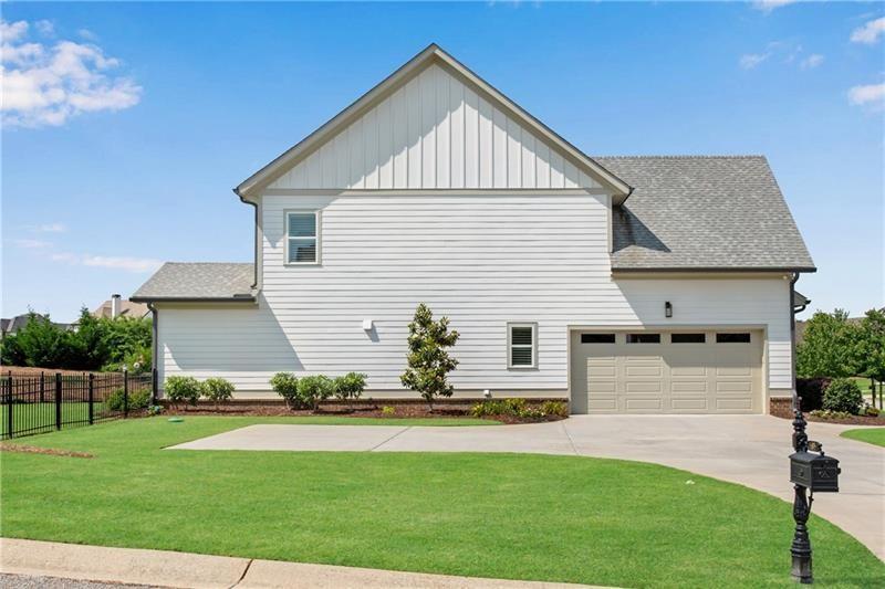 485 Delaperriere Loop Jefferson, GA 30549 - Photo 15 of 71 a front view of a house with a yard and garage