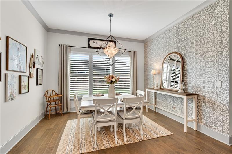 485 Delaperriere Loop Jefferson, GA 30549 - Photo 22 of 71 a view of a dining room with furniture window and wooden floor