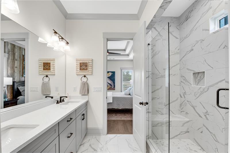 485 Delaperriere Loop Jefferson, GA 30549 - Photo 31 of 71 a spacious bathroom with a double vanity sink a shower and a mirror