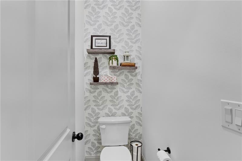 485 Delaperriere Loop Jefferson, GA 30549 - Photo 33 of 71 a bathroom with a toilet and a sink