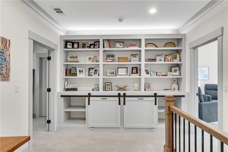 485 Delaperriere Loop Jefferson, GA 30549 - Photo 37 of 71 a view of a livingroom with shelves