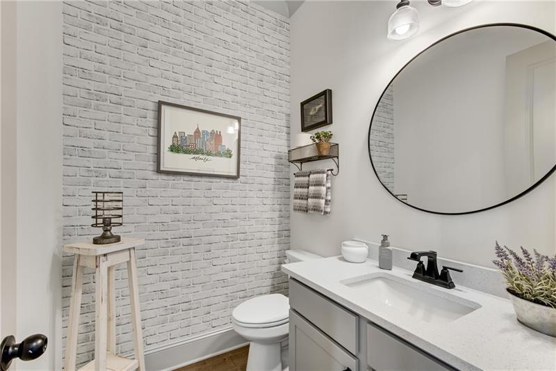 485 Delaperriere Loop Jefferson, GA 30549 - Photo 6 of 71 a bathroom with a toilet sink vanity and mirror