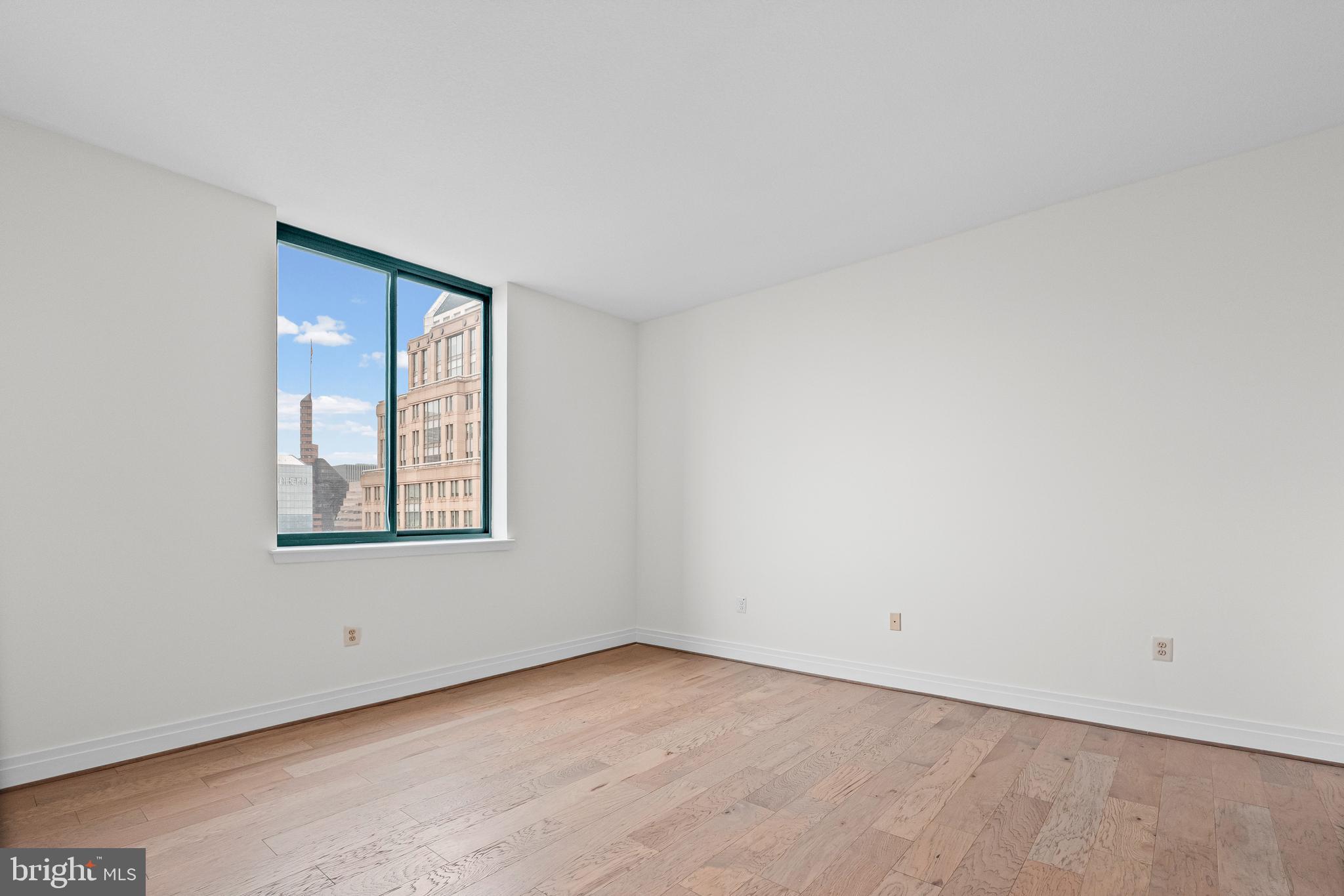 414 Water Street, Unit 2903 Baltimore, MD 21202 - Photo 23 of 46 an empty room with a window
