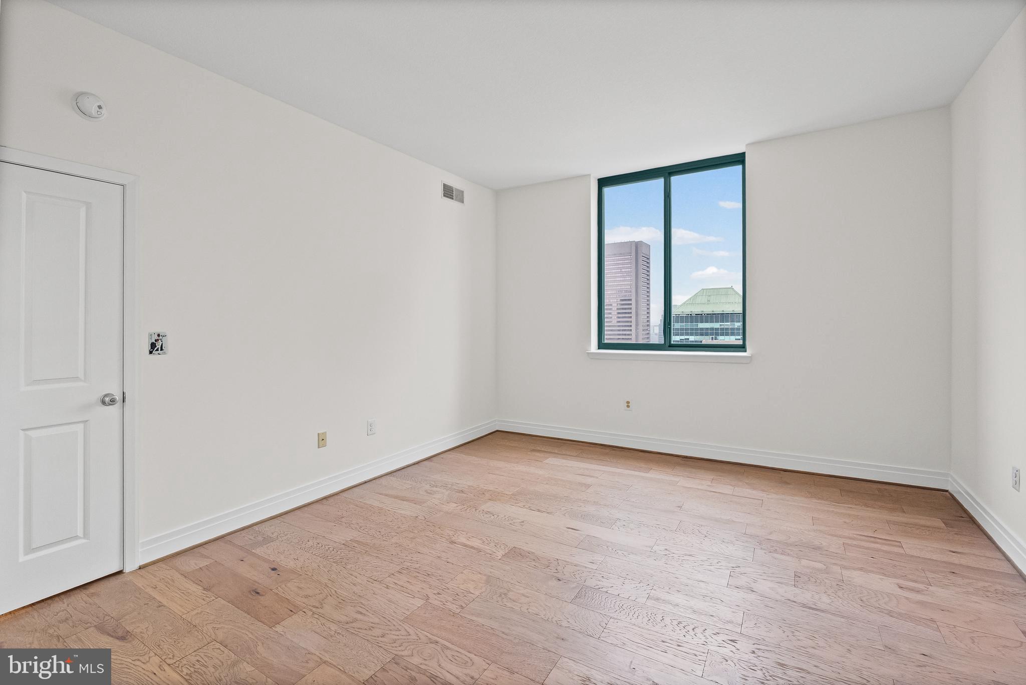 414 Water Street, Unit 2903 Baltimore, MD 21202 - Photo 29 of 46 an empty room with a window