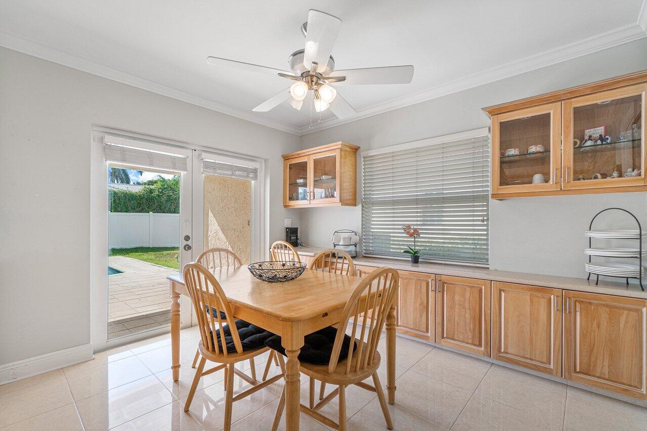 1514 Southwest 6th Terrace Boca Raton, FL 33486 - Photo 12 of 32 KITCHEN WITH VIEW TO POOL AND PATIO