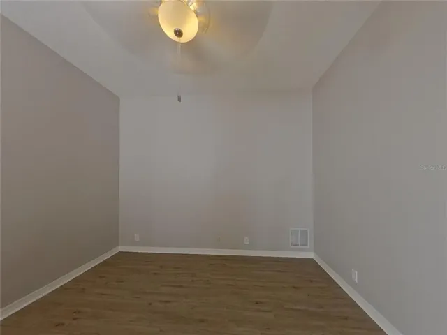 a view of a small space with wooden floor