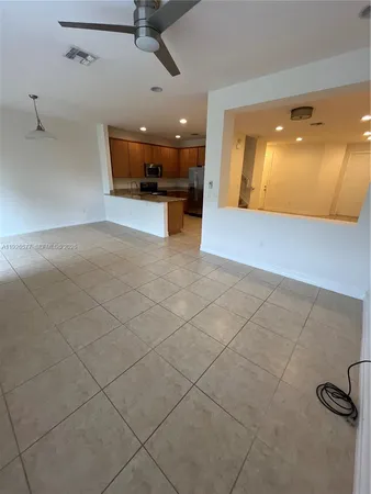 a view of a kitchen and a window