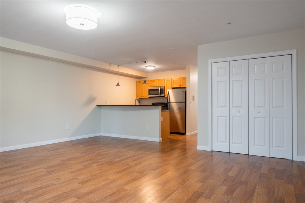 45 Chelsea Street, Unit 2 Boston, MA 02128 - Photo 3 of 10 a view of empty room with wooden floor