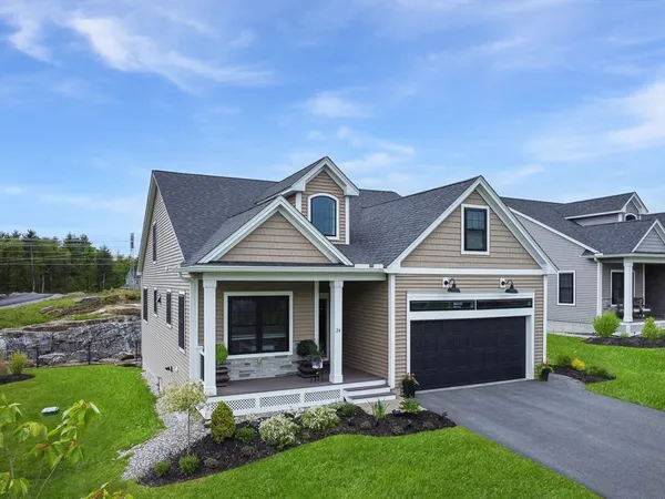 front view of a house with a yard