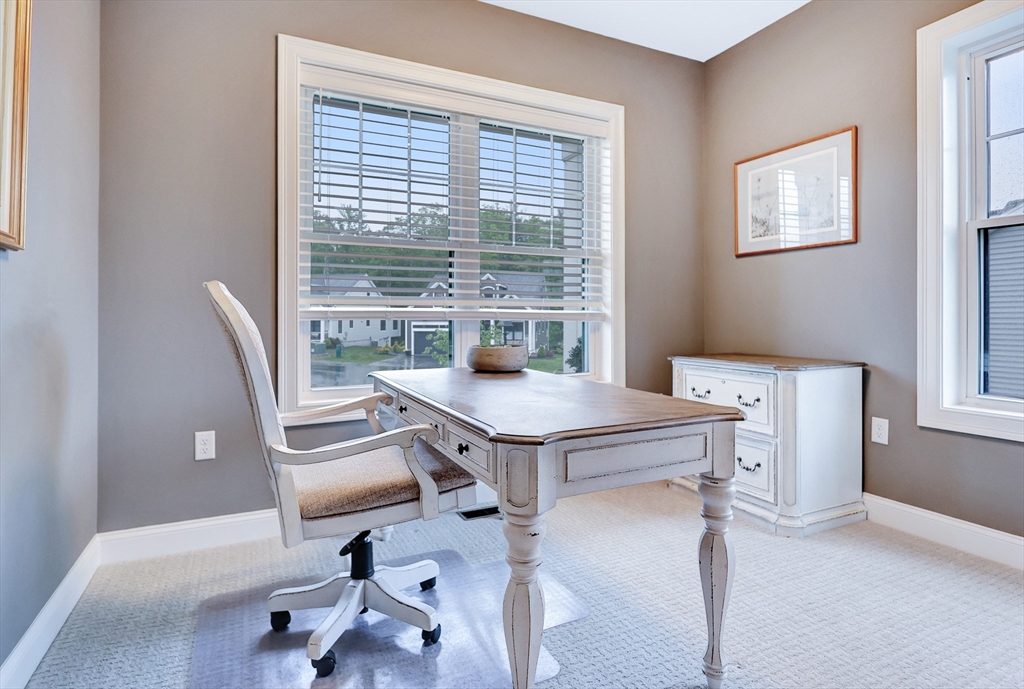 24 Del Ray Drive, Unit 25 Windham, NH 03087 - Photo 17 of 30 a view of a workspace with furniture and a window