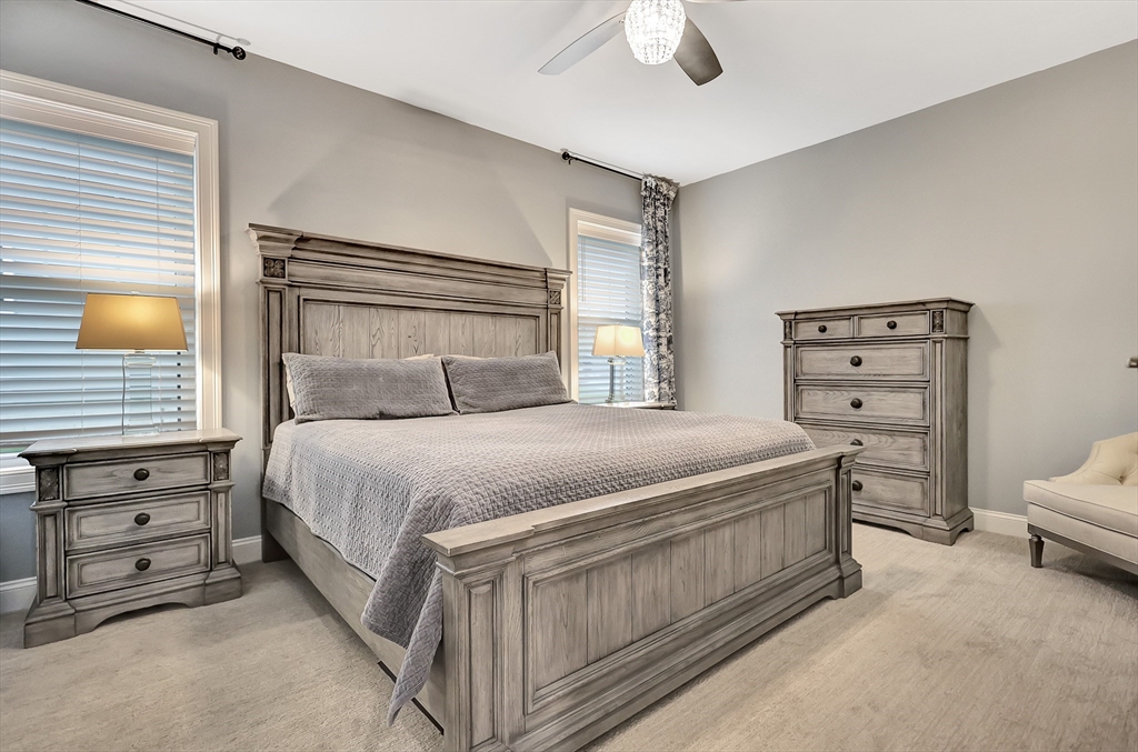 24 Del Ray Drive, Unit 25 Windham, NH 03087 - Photo 21 of 30 a bedroom with a bed and a cabinets