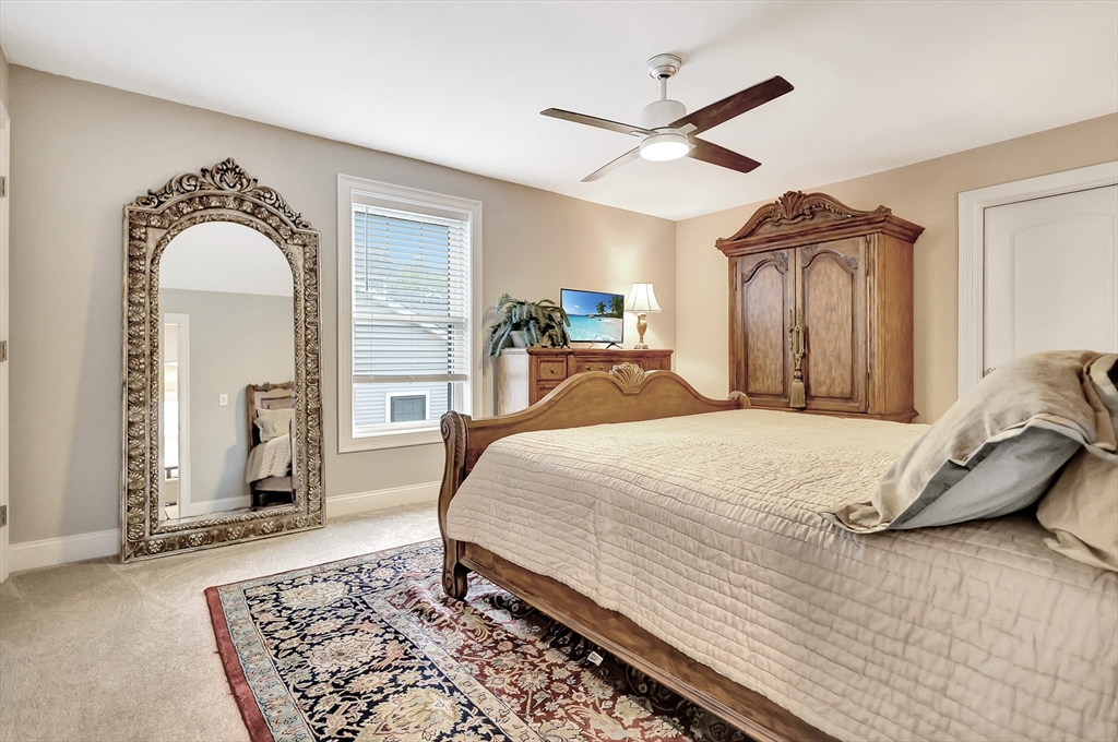 24 Del Ray Drive, Unit 25 Windham, NH 03087 - Photo 24 of 30 a bed room with a bed and a television