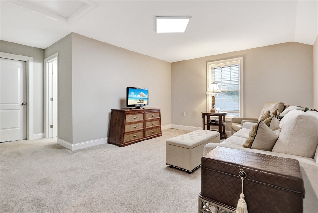 24 Del Ray Drive, Unit 25 Windham, NH 03087 - Photo 27 of 30 a bed room with furniture and a window