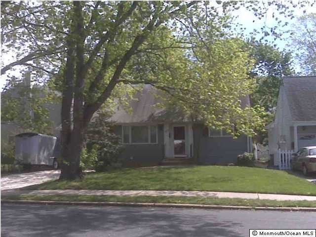 903 Ocean Road Spring Lake, NJ 07762 - Photo 1 of 1 a front view of a house with a garden