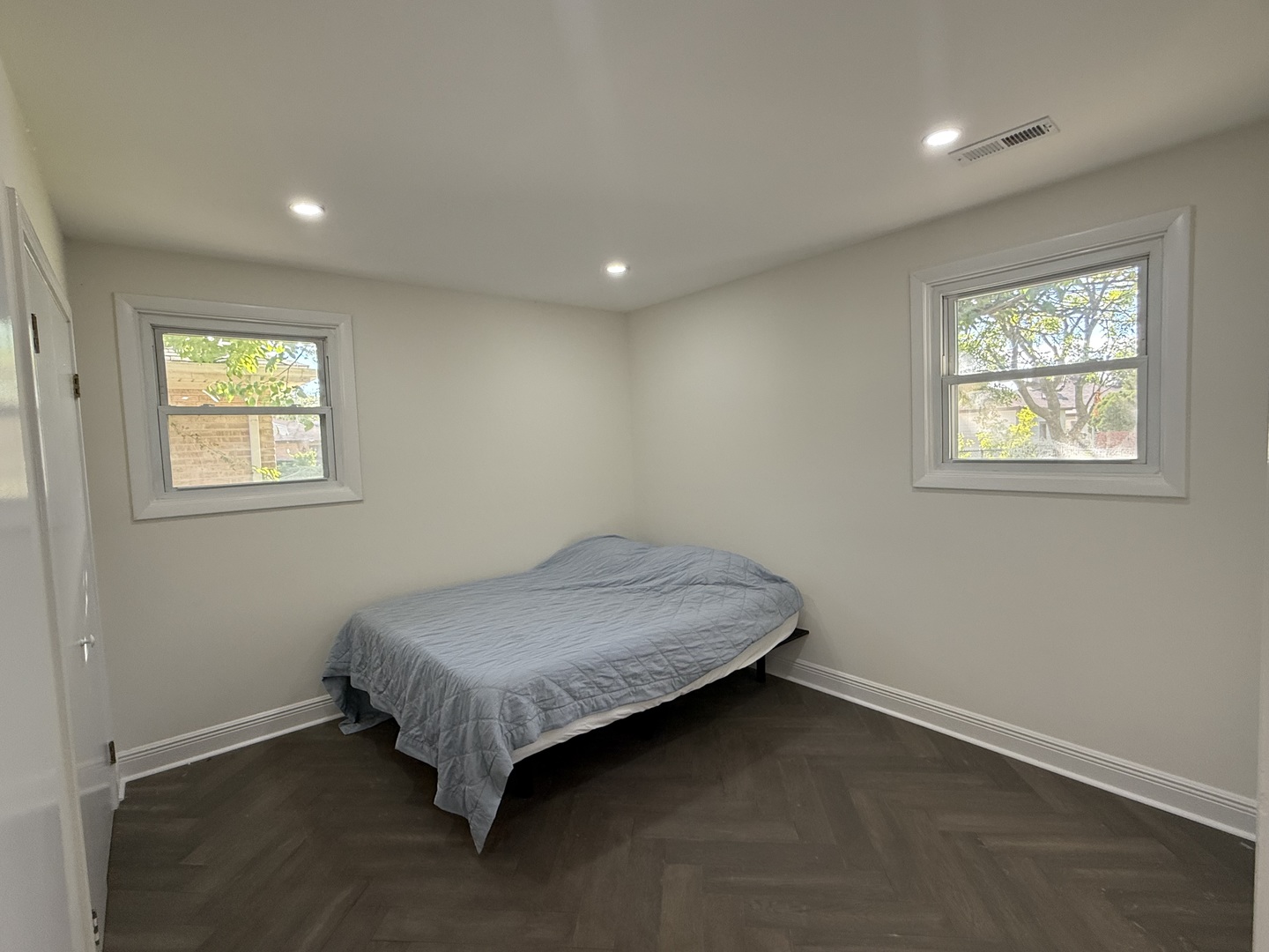 881 East Thacker Street Des Plaines, IL 60016 - Photo 11 of 17 a spacious bedroom with a bed and a window