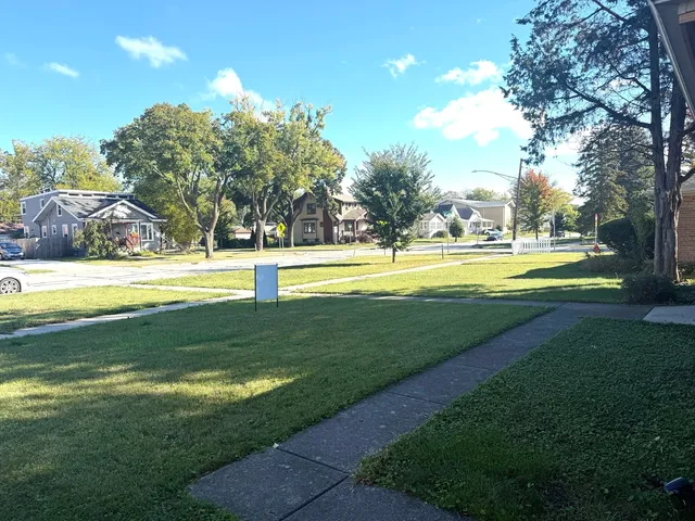 a view of a swimming pool with an outdoor space and seating