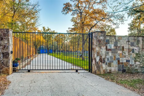 a view of a street with a iron gate