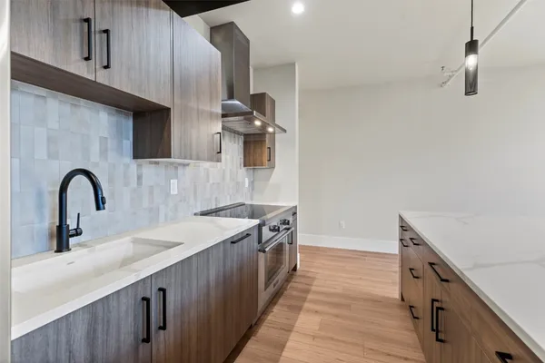 a kitchen with a sink and cabinets