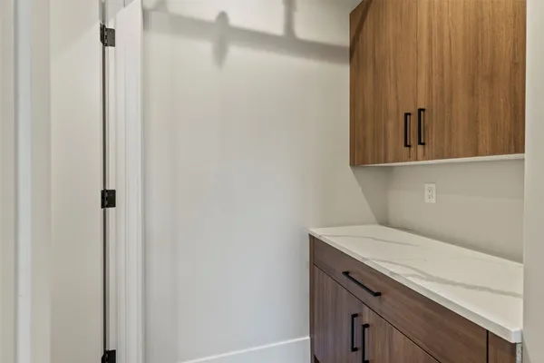 a bathroom with a sink and vanity