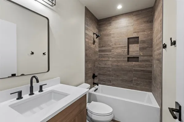 a view of a hallway with washer and dryer