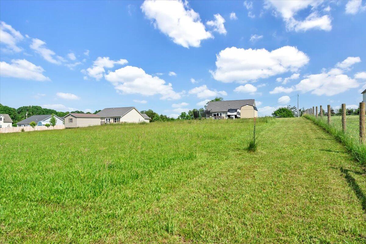 563 Kemp Ford Road Union Hall, VA 24176 - Photo 30 of 38 a view of a big yard with a large tree