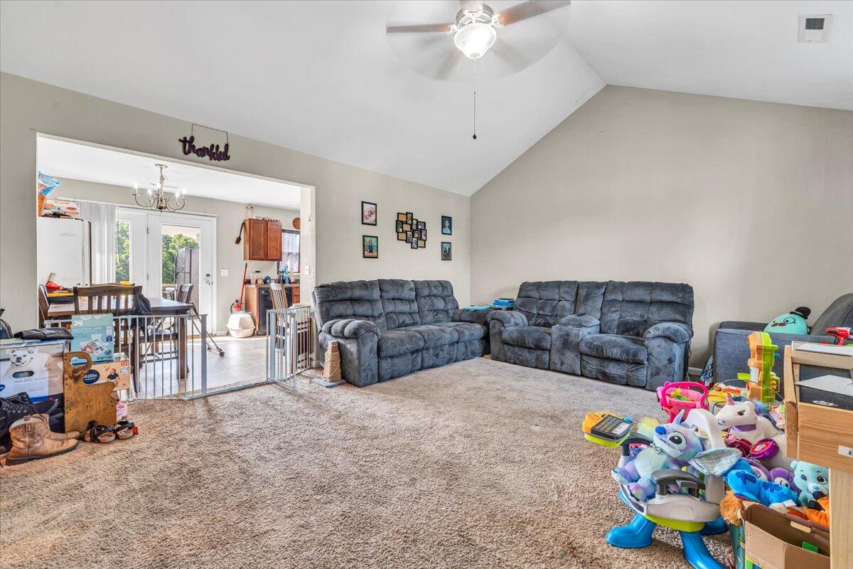 563 Kemp Ford Road Union Hall, VA 24176 - Photo 3 of 38 a living room with furniture and a chandelier
