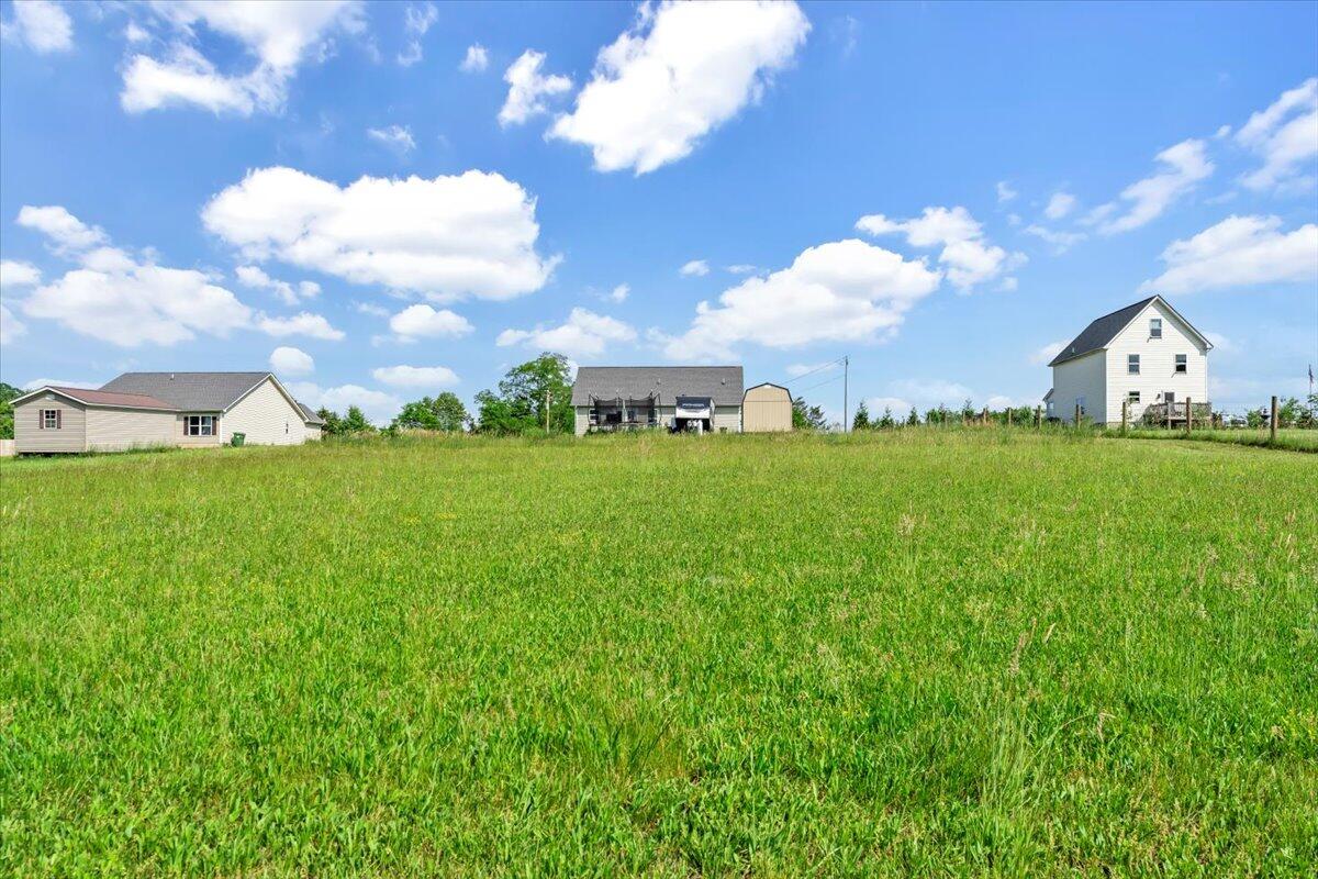 563 Kemp Ford Road Union Hall, VA 24176 - Photo 31 of 38 a view of a big yard with potted plants and large tree
