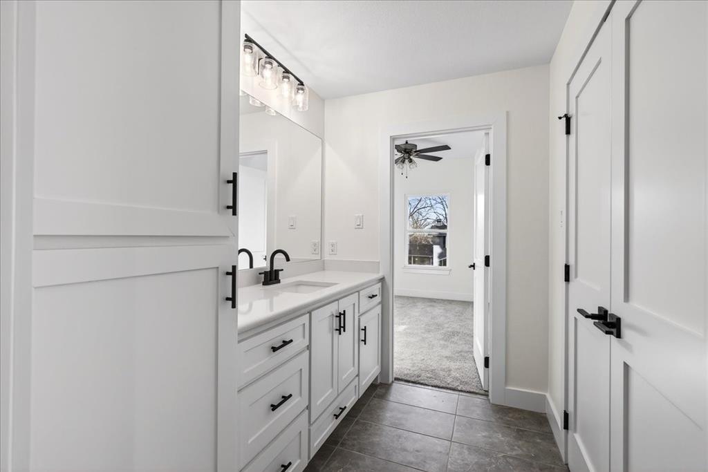 114 Castlewood Road Enchanted Oaks, TX 75156 - Photo 29 of 33 a spacious bathroom with a double vanity sink a mirror and shower