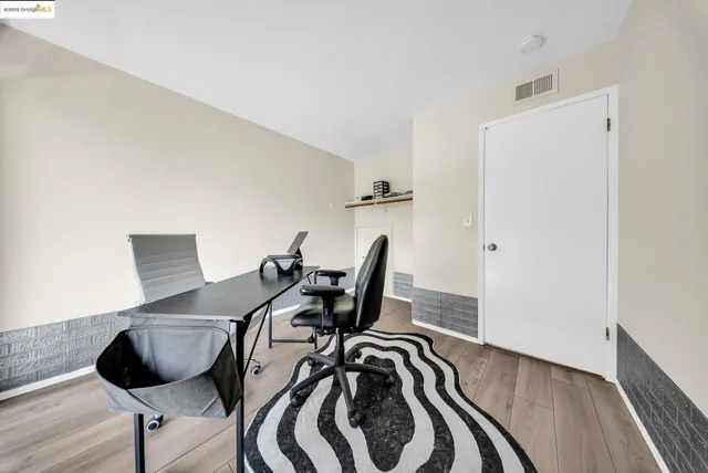 a view of a workspace with furniture