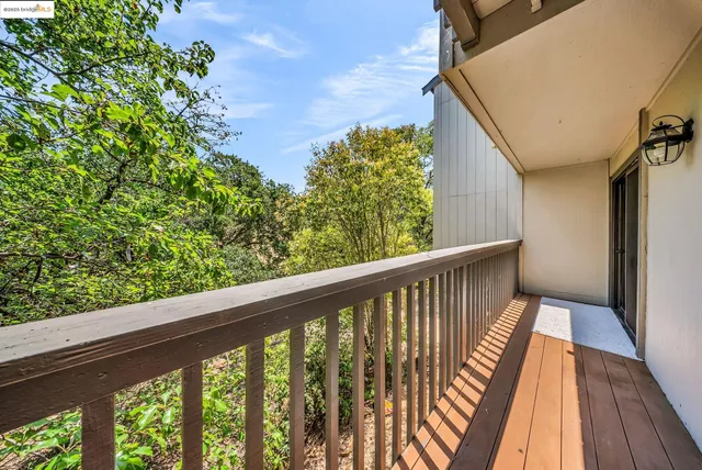 a view of balcony with wooden floor