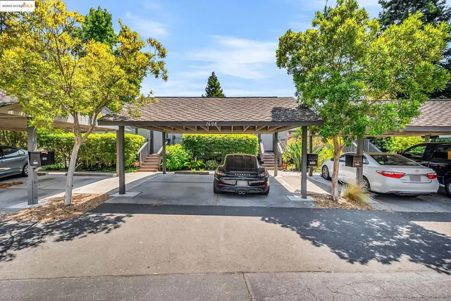 a view of a cars parked in front of a house