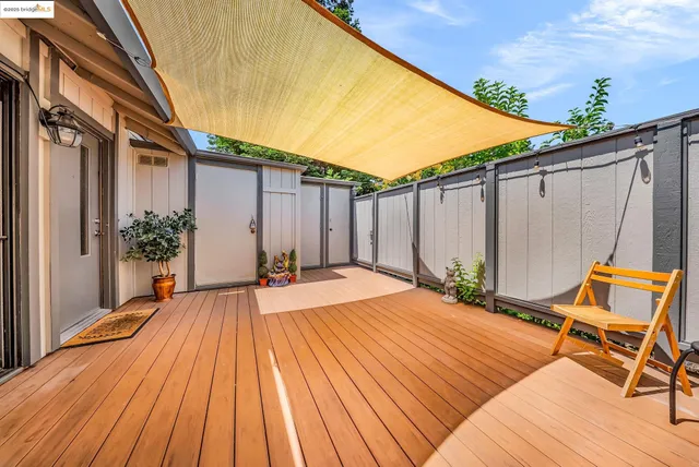 a view of a backyard with sitting area