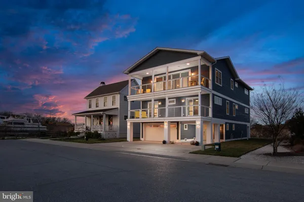 a front view of a building with a yard