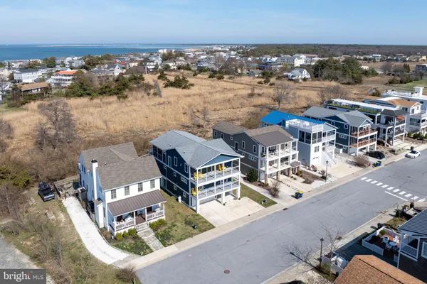 a living room with furniture a large window and a flat screen tv