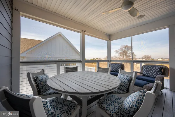 a bed sitting in a spacious bedroom next to a window