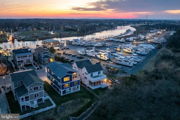 a front view of a house with yard and garage