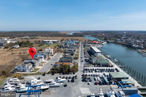 a kitchen with kitchen island granite countertop a sink and a stove