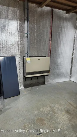 an aerial view of residential house with outdoor space and trees all around