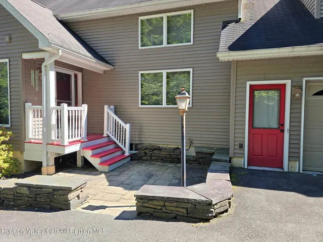 a view of house with outdoor seating