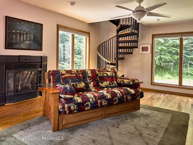a bed room with furniture and a fireplace