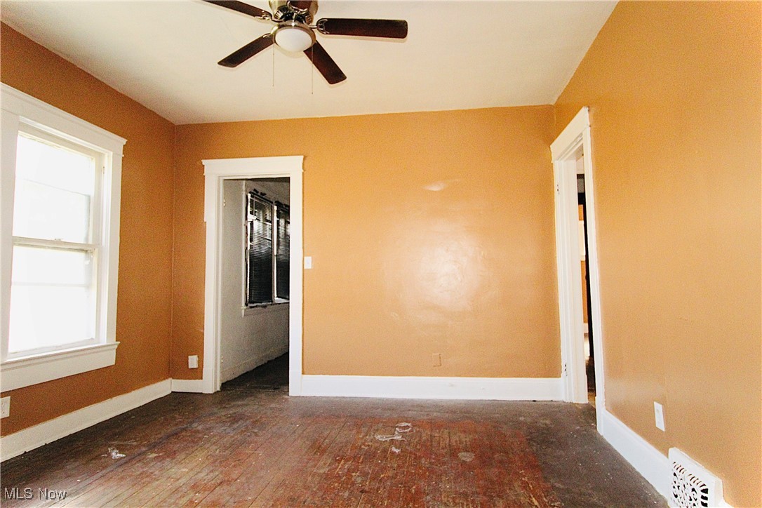 12406 Kinsman Road Cleveland, OH 44120 - Photo 3 of 29 Spare room featuring hardwood / wood-style floors and ceiling fan