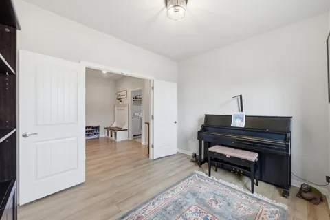 a view of kitchen with stainless steel appliances granite countertop a stove and a refrigerator