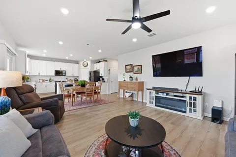 a view of a house with a yard and sitting area
