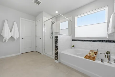 a bedroom with a bed and a chair