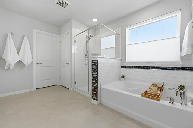 a bedroom with a bed and a chair